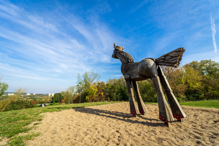 BERLIN - OCTOBER 15, 2019: Sculpture of a wooden horse in the nature park of the Marzahn-Hellersorf district.のeditorial素材