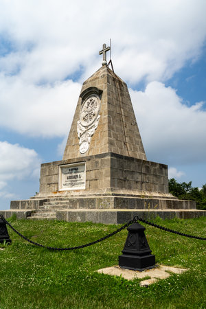 Monument of the Russian emperor Alexander II on Shipka Peak in Bulgaria. The text in Cyrillic: In honor of the reign of Emperor Alexander II.のeditorial素材