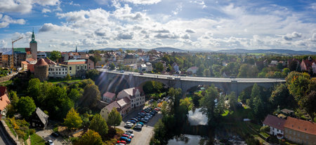 BAUTZEN, GERMANY - OCTOBER 10, 2019: Panoramic view of the town (apartment building, bridge and Spree river) from the height of the old Waterworks tower. Lens flare.のeditorial素材