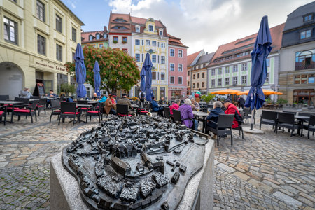 BAUTZEN, GERMANY - OCTOBER 10, 2019: City Hall Square and street cafe. In the foreground is the layout of the city.のeditorial素材
