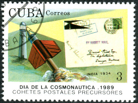 CUBA - CIRCA 1989: A stamp printed in Cuba, dedicated to Cosmonautics Day, depicts the spacecraft and rocket mail covers: Lighthause and cover, India, 1934, circa 1989のeditorial素材
