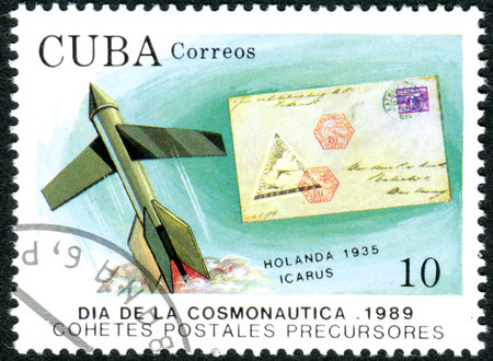CUBA - CIRCA 1989: A stamp printed in Cuba, dedicated to Cosmonautics Day, depicts the spacecraft and rocket mail covers: Icarus and cover, The Netherlands, 1935, circa 1989のeditorial素材