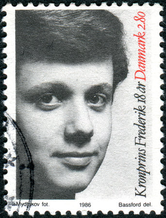 DENMARK - CIRCA 1986: A stamp printed in Denmark, depicts of Frederik, Crown Prince of Denmark, Count of Monpezat, circa 1986のeditorial素材