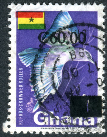 GHANA - CIRCA 1967: A stamp printed in Ghana, depicted the Rufous-crowned Roller (Coracias naevia) - surcharged 1988, circa 1967のeditorial素材