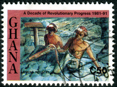 GHANA - CIRCA 1992: A stamp printed in Ghana, dedicated to Decade of Revolutionary Progress, depicted the Mining Industry, circa 1992のeditorial素材
