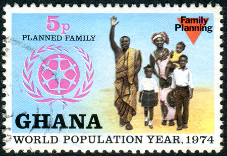 GHANA - CIRCA 1974: A stamp printed in Ghana, dedicated to World Population Year, depicted the Family and WPY Emblem, circa 1974のeditorial素材