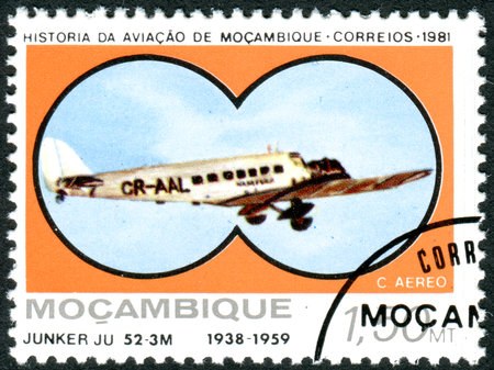 MOZAMBIQUE - CIRCA 1987: A stamp printed in Mozambique, depicted the airplane Junker JU-52-3M, (1938), circa 1987のeditorial素材