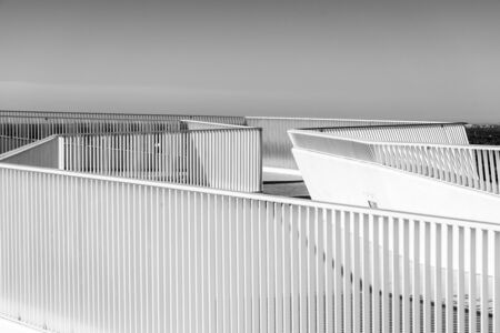 Abstract shapes from a metal fence. Black and white.
