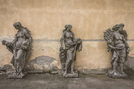 Antique sculptures of women in various forms at Tetschen Castle. Decin. Czech Republic. Vintage stylization.のeditorial素材