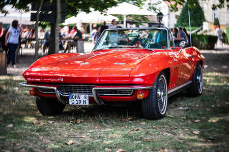 DIEDERSDORF, GERMANY - AUGUST 21, 2021: The sports car Chevrolet Corvette Sting Ray Convertible (C2). Focus on center. Swirly bokeh. The exhibition of "US Car Classics".のeditorial素材