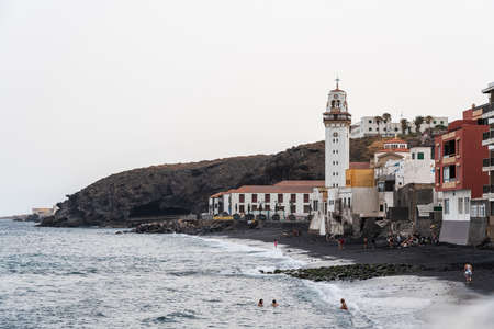 CANDELARIA, SPAIN - JULY 11, 2021: View of the city (municipal) beach and the Basilica of Our Lady of Candelaria.の写真素材