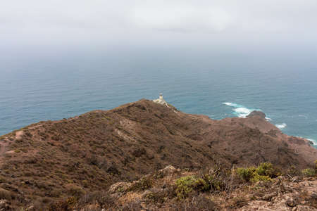 Mountain landscape in the north of the island. In the background, in the valley, the village of Chamorga. Tenerife. Canary Islands. Spain.の写真素材