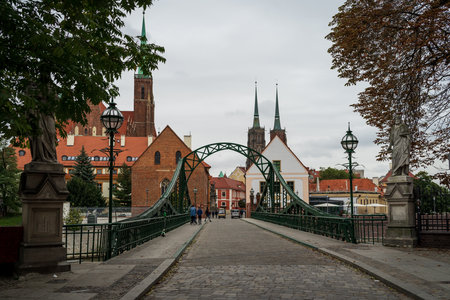 WROCLAW, POLAND - OCTOBER 14, 2021: Old city streets. In the background is Tumski Bridge (1889).のeditorial素材