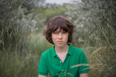 Portrait of a boy on the background of nature.の写真素材