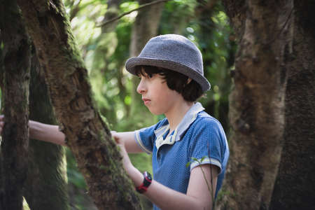 Portrait of a teenager in a tropical relic forest. Tenerife. Canary Islands. Spain.