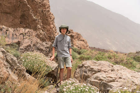 Portrait of a teenager on the background of rocks.の写真素材