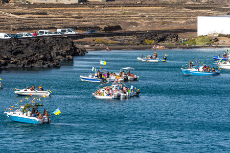 ARRECIFE, LANZAROTE, CANARY ISLANDS - JULY 17, 2022: Pleasure motor boats of capital residents in the water area of the seaport.のeditorial素材