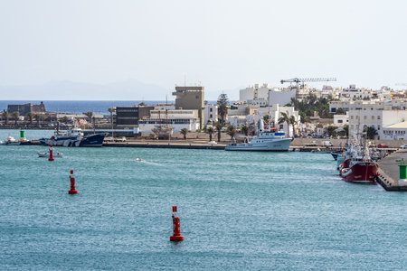 ARRECIFE, LANZAROTE, CANARY ISLANDS - JULY 17, 2022: Commercial sea port. Arrecife is the capital of the island.のeditorial素材