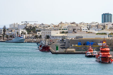 ARRECIFE, LANZAROTE, CANARY ISLANDS - JULY 17, 2022: Commercial sea port. Arrecife is the capital of the island.のeditorial素材