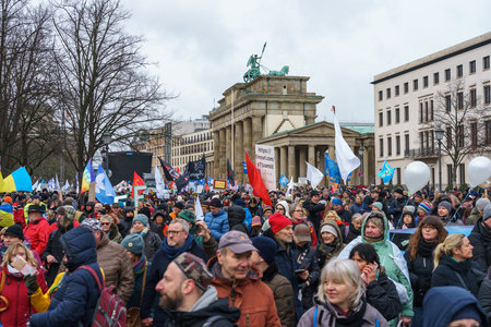 BERLIN - FEBRUARY 25, 2023: A large demonstration at the Brandenburg Gate Under the Motto "Manifesto For Peace". Peace negotiations instead of weapons!のeditorial素材