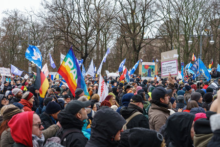 BERLIN - FEBRUARY 25, 2023: A large demonstration at the Brandenburg Gate Under the Motto Manifesto...