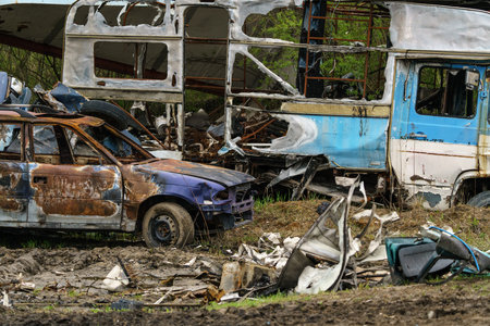 Car dump. Various vehicles in ruined condition.