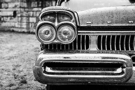 FINOWFURT, GERMANY - MAY 06, 2023: The fragment of full-size car Mercury Turnpike Cruiser in rain of drops, 1957. Black and white. Race festival 2023. Season opening.のeditorial素材