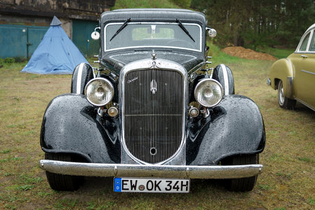 FINOWFURT, GERMANY - MAY 06, 2023: The full-size car Plymouth De Luxe in drops of rain, 1934. Race festival 2023. Season opening.のeditorial素材