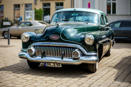 WERDER (HAVEL), GERMANY - MAY 20, 2023: The full-size car Buick Super Riviera Sedan. Swirl bokeh, art lens. Oldtimer - Festival Werder Classics 2023のeditorial素材