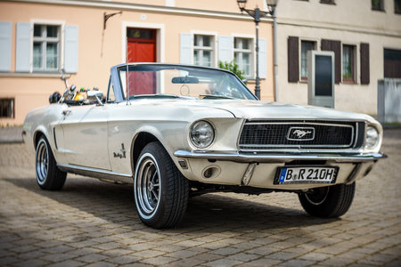 WERDER (HAVEL), GERMANY - MAY 20, 2023: The muscle car Ford Mustang Convertible. Swirl bokeh, art lens. Oldtimer - Festival Werder Classics 2023のeditorial素材