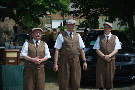WERDER (HAVEL), GERMANY - MAY 20, 2023: Street performers of songs dressed in the style of the 30s of the 20th century. Swirl bokeh, art lens. Oldtimer - Festival Werder Classics 2023のeditorial素材