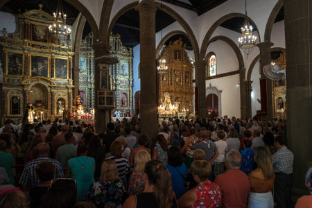 PUERTO DE LA CRUZ, SPAIN - JULY 16, 2023: Solemn worship service in honor of Our Lady of Mount Carmel at Nuestra Senora de la Pena de Francia church.のeditorial素材