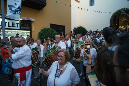 PUERTO DE LA CRUZ, SPAIN - JULY 16, 2023: Procession in honor of Our Lady of Mount Carmel through the streets of the town.のeditorial素材