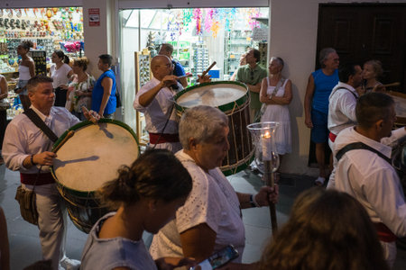 PUERTO DE LA CRUZ, SPAIN - JULY 16, 2023: Procession in honor of Our Lady of Mount Carmel through the streets of the town.のeditorial素材
