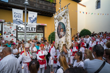 PUERTO DE LA CRUZ, SPAIN - JULY 16, 2023: Procession in honor of Our Lady of Mount Carmel through the streets of the town.のeditorial素材