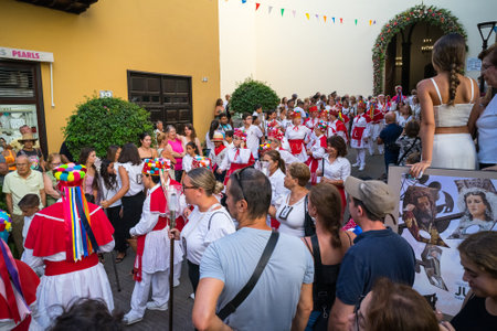 PUERTO DE LA CRUZ, SPAIN - JULY 16, 2023: Procession in honor of Our Lady of Mount Carmel through the streets of the town.のeditorial素材