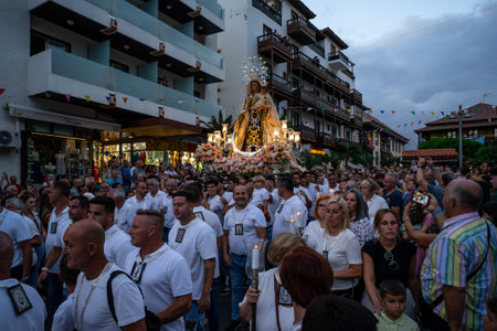PUERTO DE LA CRUZ, SPAIN - JULY 16, 2023: Procession in honor of Our Lady of Mount Carmel through the streets of the town.のeditorial素材