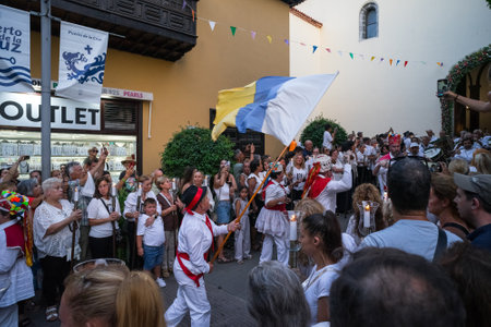 PUERTO DE LA CRUZ, SPAIN - JULY 16, 2023: Procession in honor of Our Lady of Mount Carmel through the streets of the town.のeditorial素材