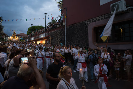 PUERTO DE LA CRUZ, SPAIN - JULY 16, 2023: Procession in honor of Our Lady of Mount Carmel through the streets of the town.のeditorial素材