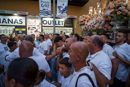 PUERTO DE LA CRUZ, SPAIN - JULY 16, 2023: Procession in honor of Our Lady of Mount Carmel through the streets of the town.のeditorial素材