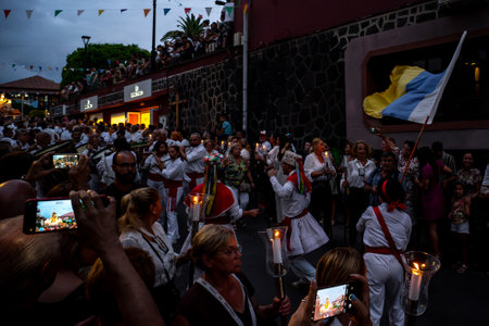 PUERTO DE LA CRUZ, SPAIN - JULY 16, 2023: Procession in honor of Our Lady of Mount Carmel through the streets of the town.のeditorial素材
