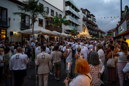 PUERTO DE LA CRUZ, SPAIN - JULY 16, 2023: Procession in honor of Our Lady of Mount Carmel through the streets of the town.のeditorial素材