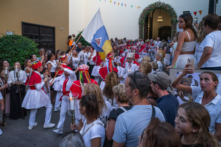 PUERTO DE LA CRUZ, SPAIN - JULY 16, 2023: Procession in honor of Our Lady of Mount Carmel through the streets of the town.のeditorial素材