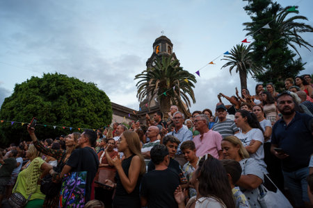 PUERTO DE LA CRUZ, SPAIN - JULY 16, 2023: Procession in honor of Our Lady of Mount Carmel through the streets of the town.のeditorial素材
