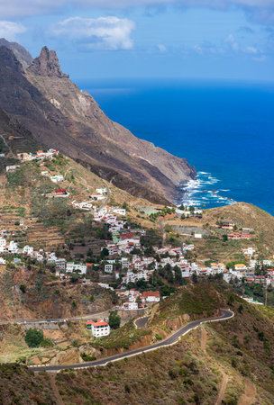 Panoramic view of the mountains of the northern part of Tenerife, small town of Taganana and Atlantic ocean. Canary Islands. Spain. View from the observation deck - Mirador Risco Amogoje.の写真素材