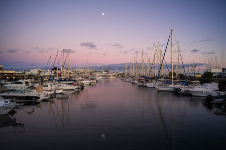 PLAYA BLANCA, LANZAROTE - OCTOBER 25, 2023: Evening on Marina Rubicon of Playa Blanca. Playa Blanca is the southernmost town of the Spanish island of Lanzarote. It is the newest resort on the island.のeditorial素材