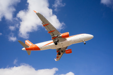 ARRECIFE, LANZAROTE - OCTOBER 28, 2023: Landing of an Airbus A320-214 operated by easyJet at Cesar...