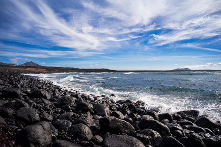 Seascape. Rocky shore of a raging ocean. Lanzarote, Canary Islands. Spain.の写真素材