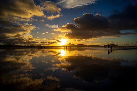 The evening's Famara Beach (Playa de Famara) -  popular surfing beach in Lanzarote. Canary Islands. Spain.の写真素材