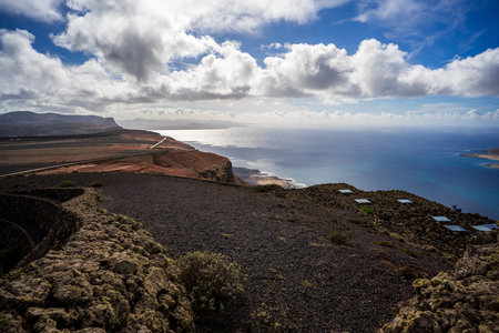 View of Atlantic ocean and rocky shore from Mirador Del Rio. Lanzarote. Canary Islands. Spain.の写真素材